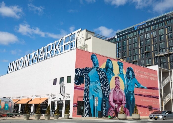 Union Market District building in DC with figural art mural.