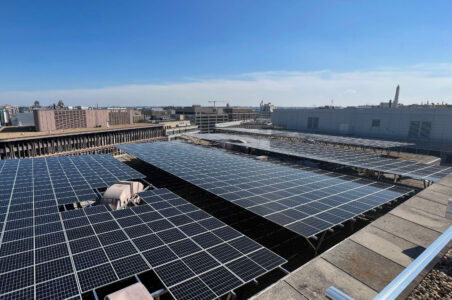Rooftop solar array of Washington Square building with the downtown DC skyline in the background.