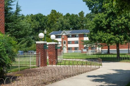 Paradise at Parkside apartment complex in Ward 7 with a community solar array visible on the building in the background.