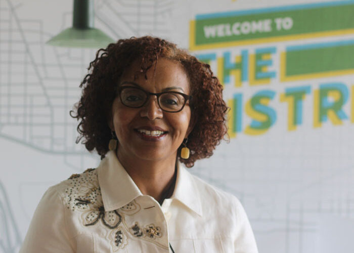 Hayat Kelil-Brown, CEO and Managing Member, of Hayat Brown LLC posing at the DCSEU offices.