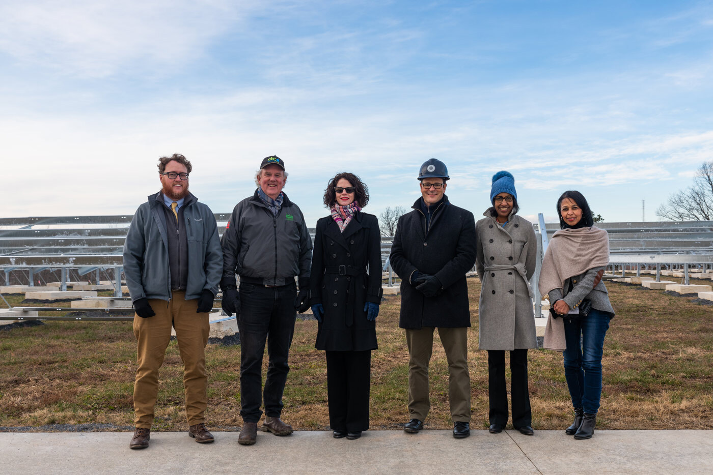 Group of principals at the Brentwood Reservoir community solar project under construction.