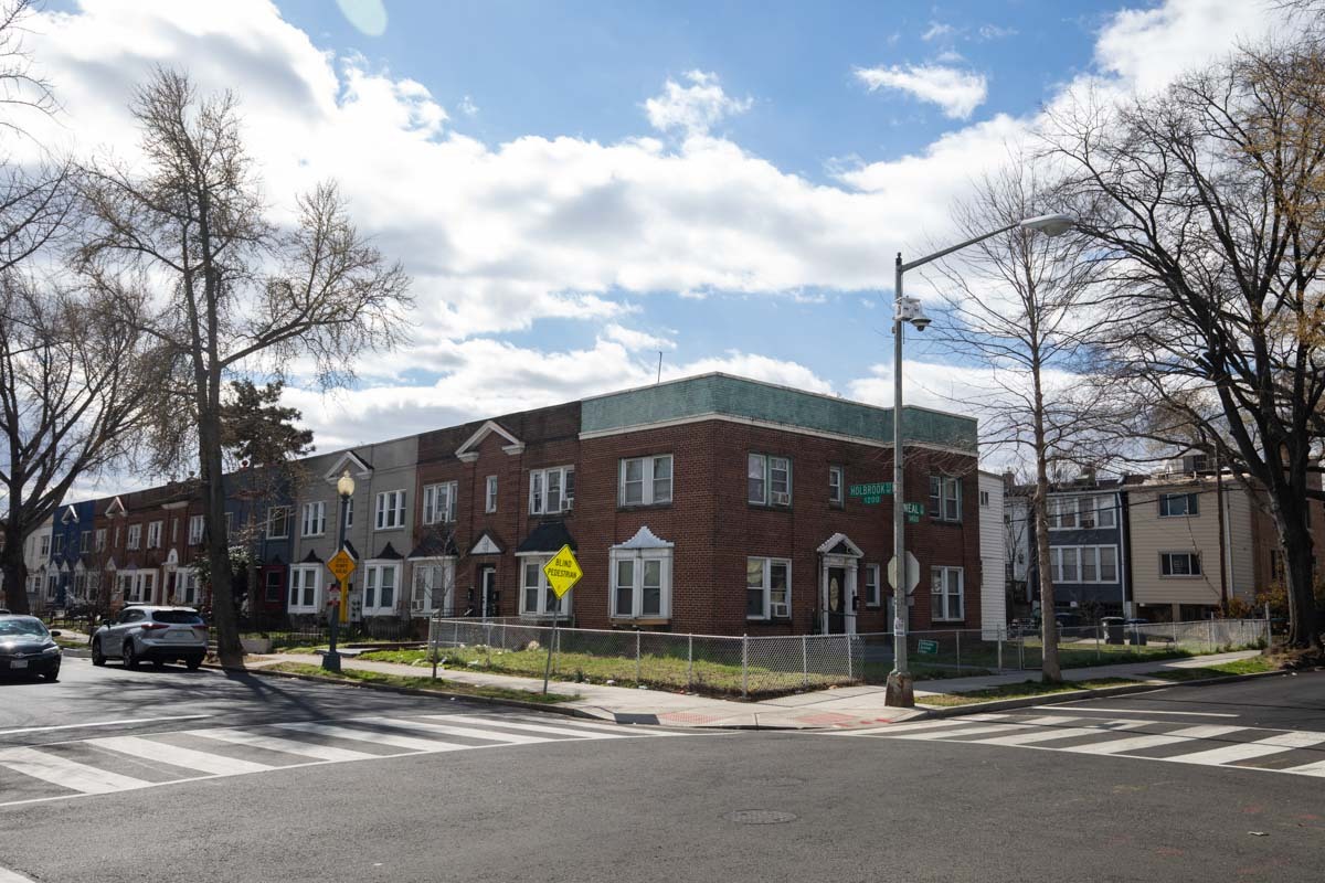 Cross street of DC row homes in the winter.