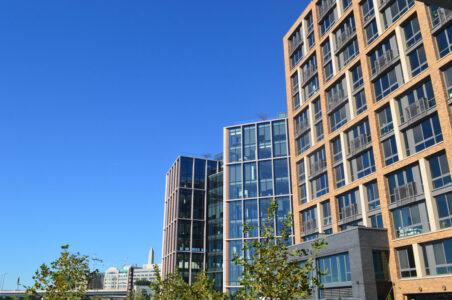 Set of office and multifamily buildings at the Wharf in DC.