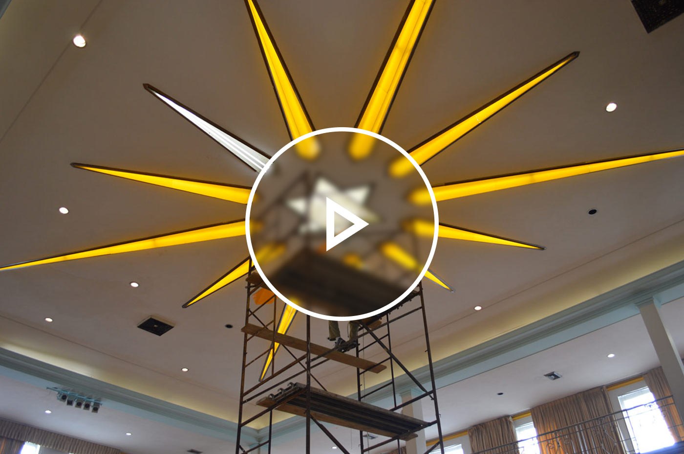 Scaffolding going up towards a LED Star of David on the ceiling of a house of worship.