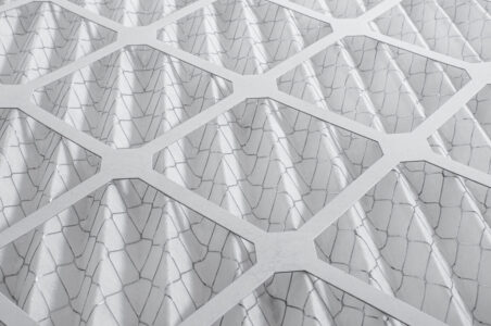 Closeup of a white HVAC air filter.