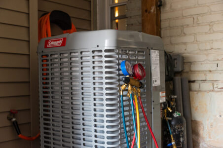 Closeup of a heat pump compressor.