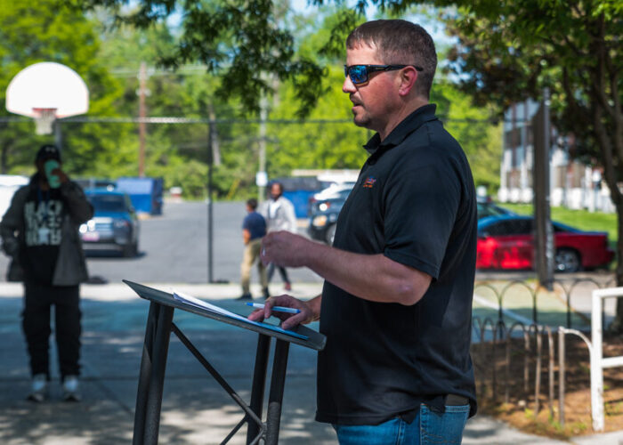 The John G. Webster Company President, Silas Naecker, at a podium providing remarks.