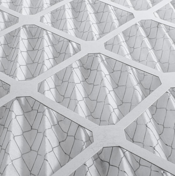 Closeup of a white HVAC air filter.