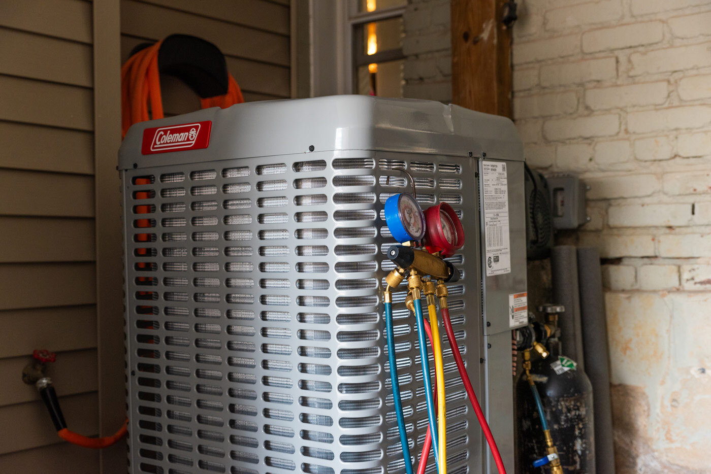 Closeup of a heat pump compressor.